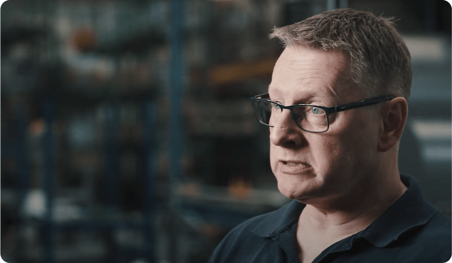 Paul Molloy on the factory floor with a manufacturing team